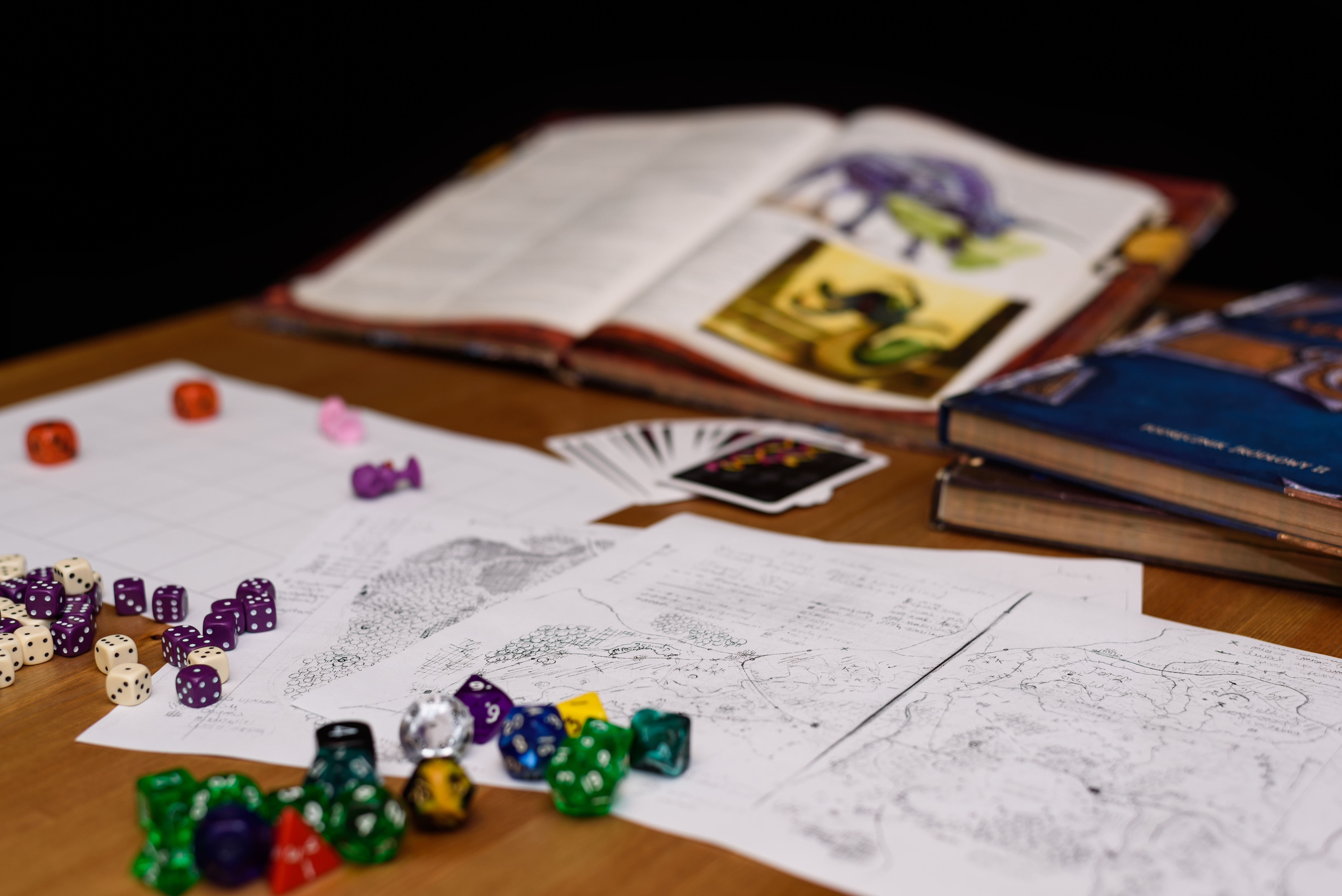 role playing game set up on table isolated on black background